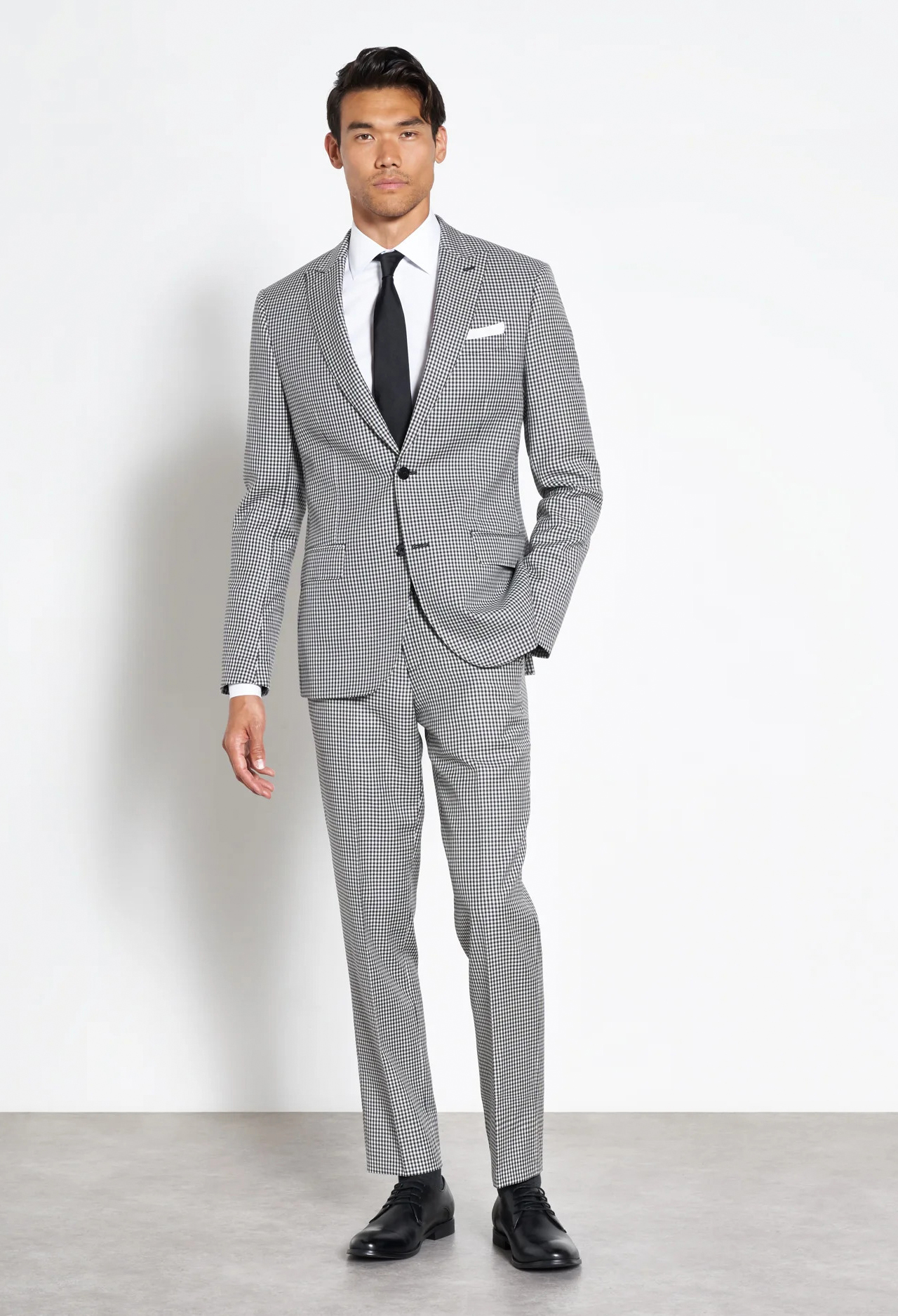 grey gingham plaid suit with white shirt and black tie