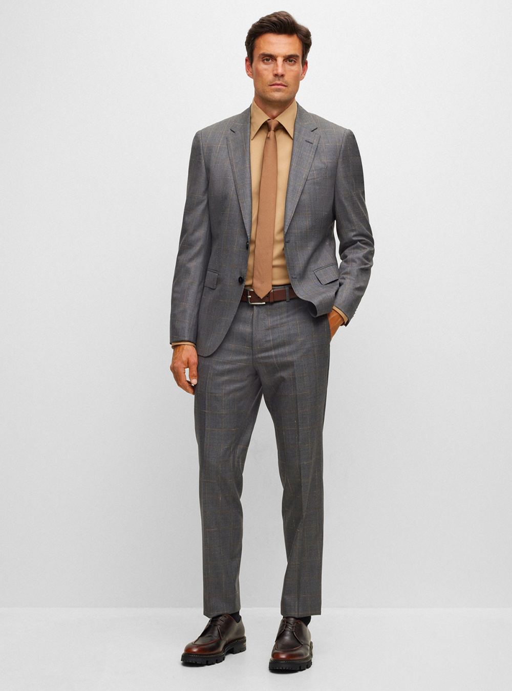 Grey suit, brown dress shirt, brown tie and dark brown derby shoes