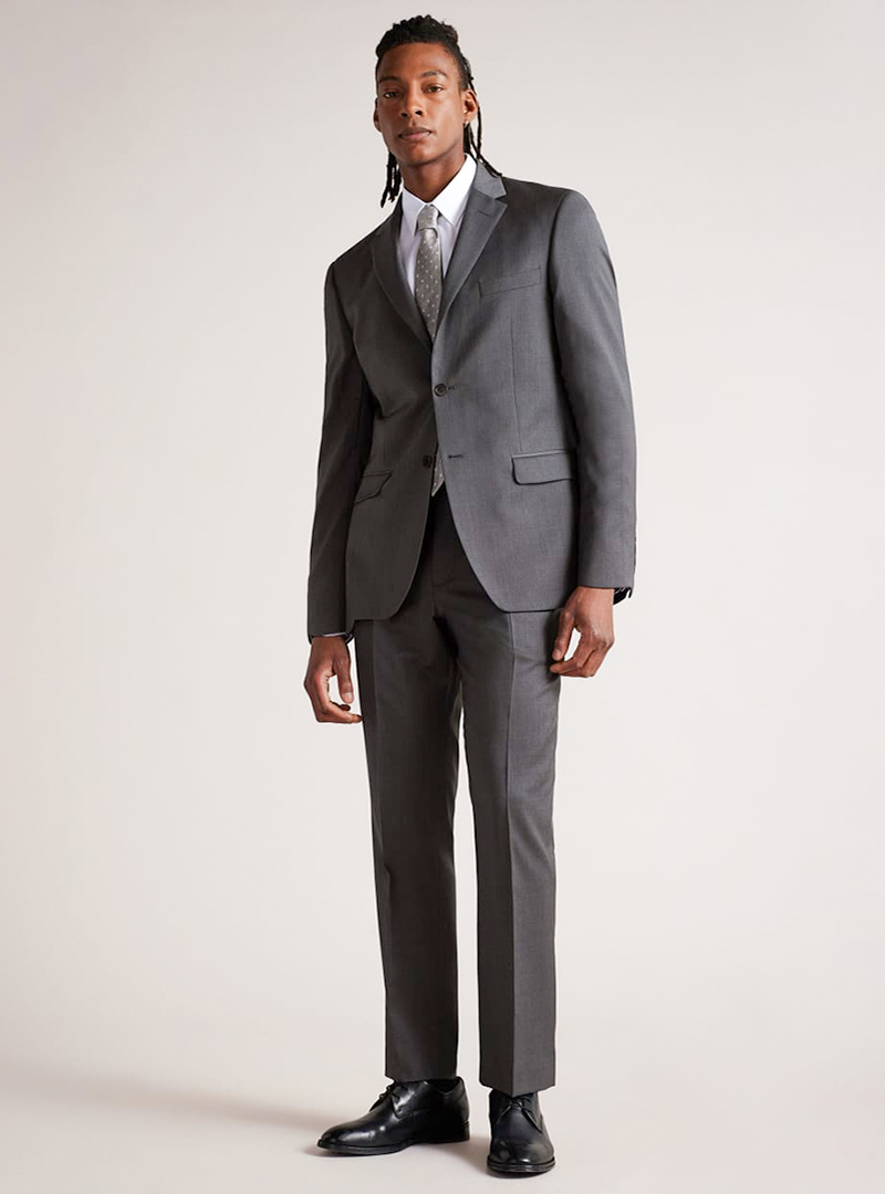 Grey suit, white dress shirt, light grey dotted tie and black derby shoes