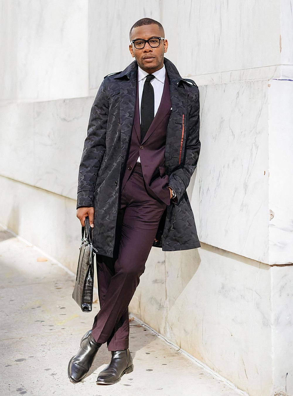 burgundy suit, white shirt, and black tie and Chelsea boots