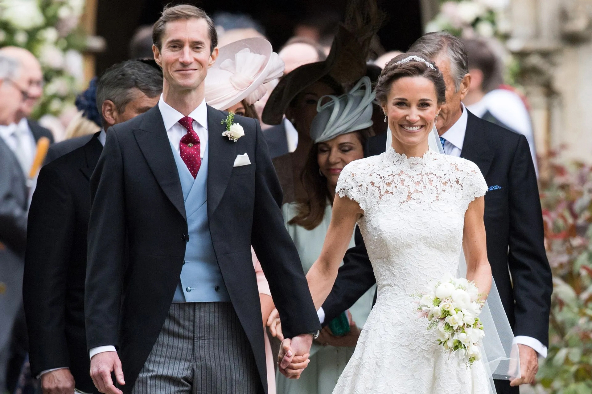 groom wearing a morning coat at a winter wedding