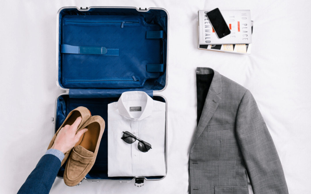 how to fold and pack a suit into suitcase for travelling