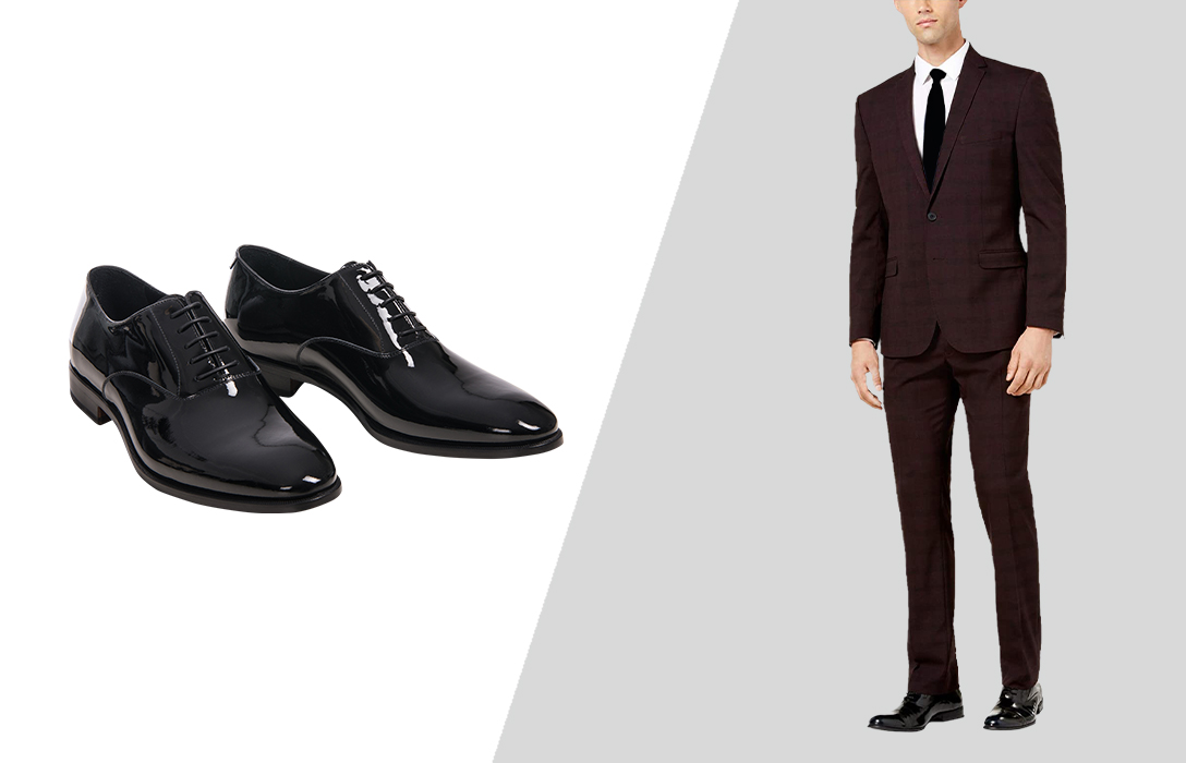 black oxford shoes with a burgundy suit, white, shirt, and black tie