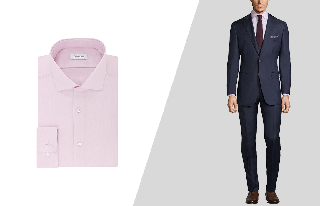 navy suit with a light pink dress shirt is a playful cocktail attire example