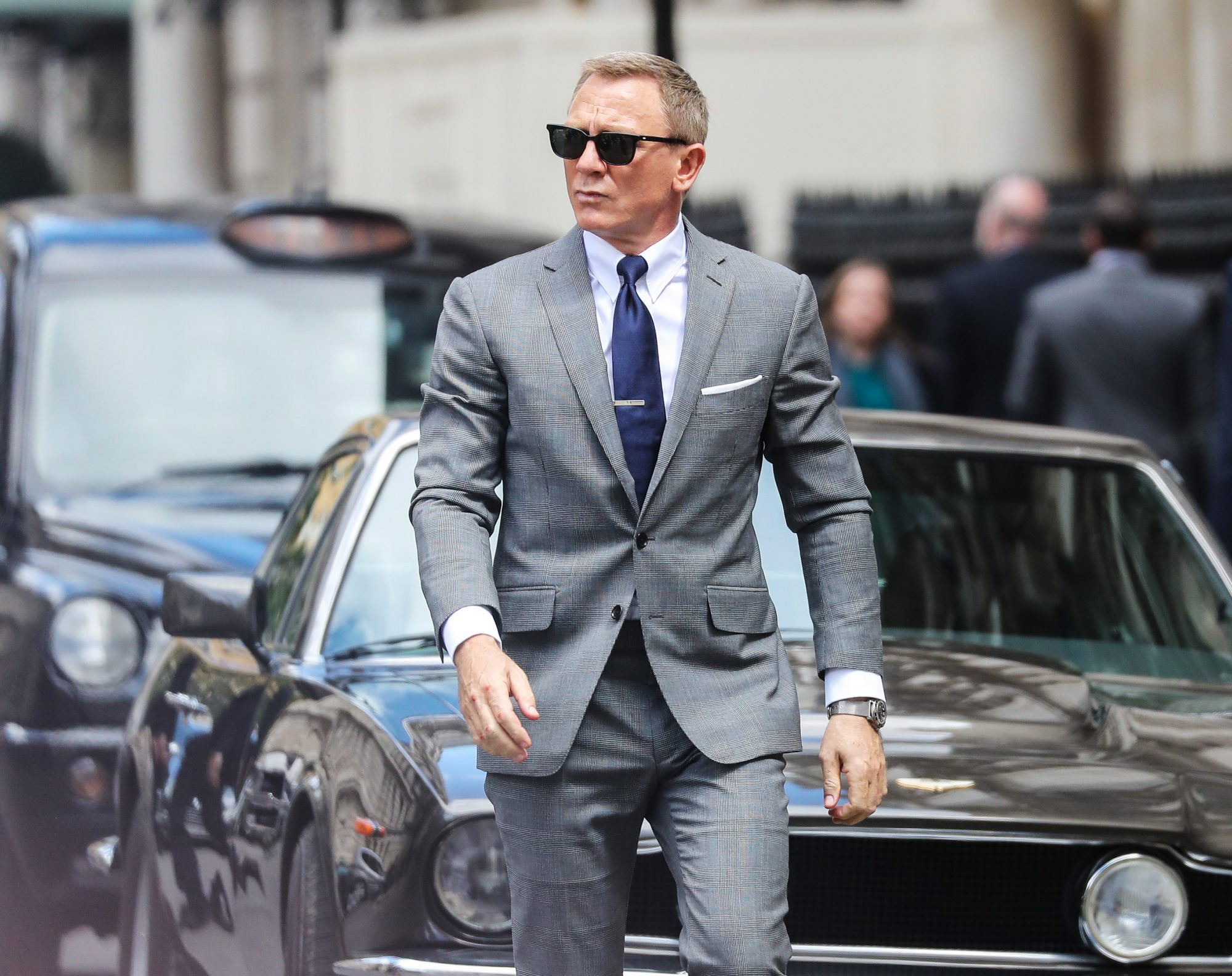 James Bond wearing light grey suit