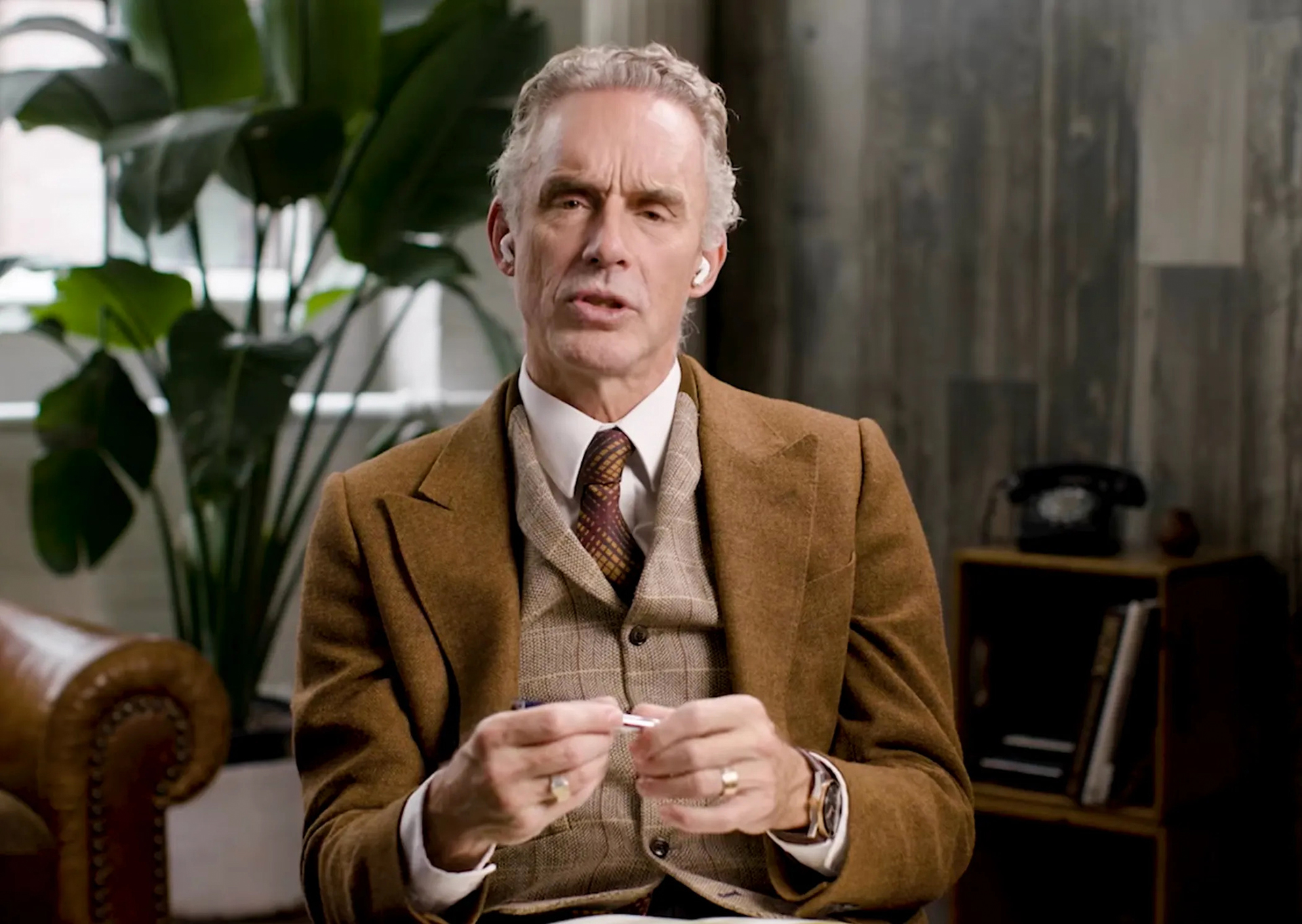 Jordan Peterson in a brown tweed suit