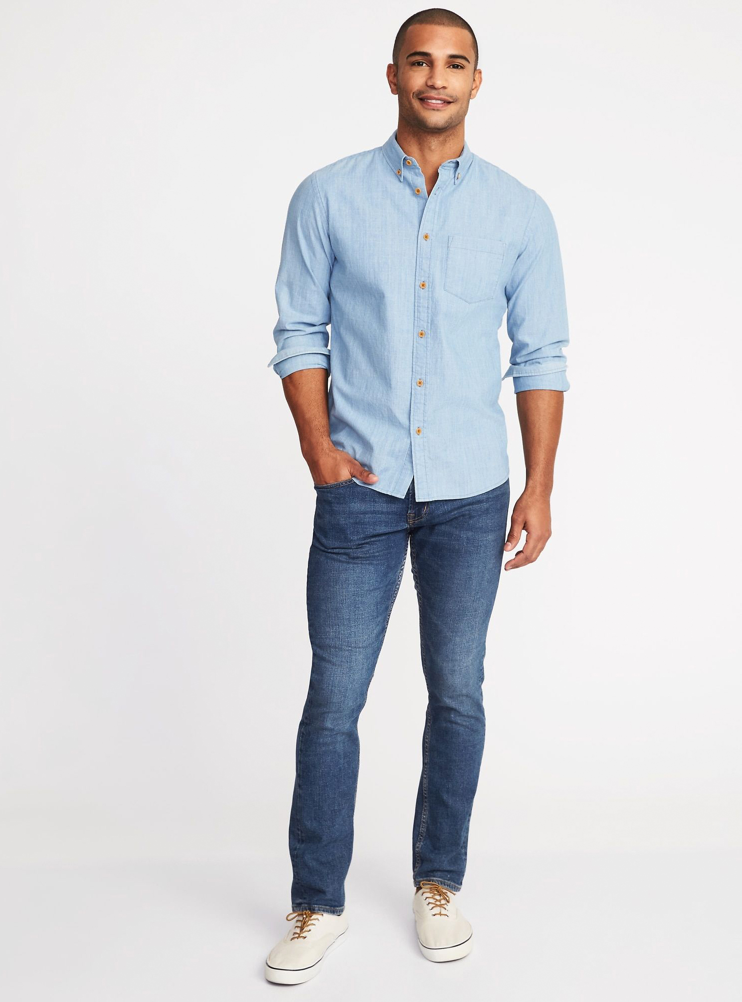 light blue button down shirt, blue jeans, and white sneakers