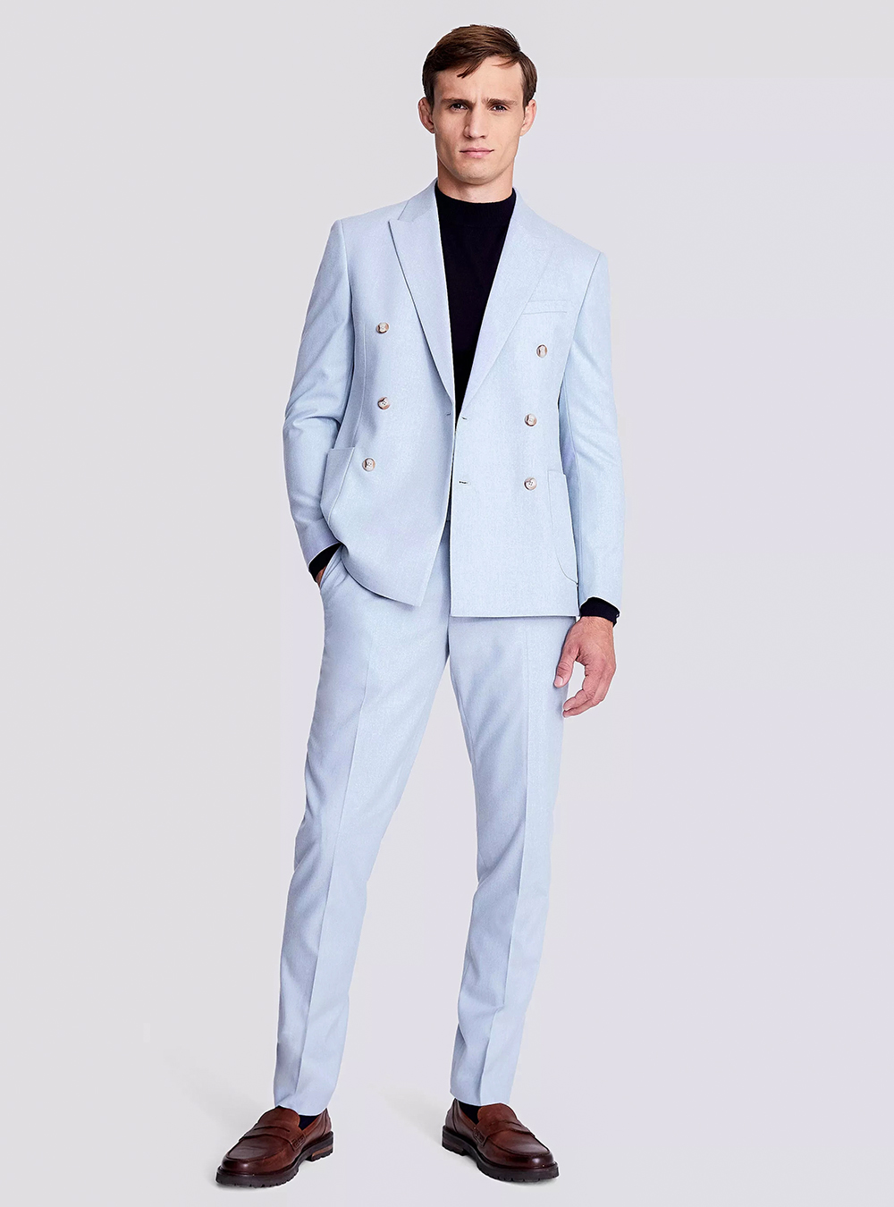 Light blue double-breasted suit, black crew-neck sweater and brown loafers
