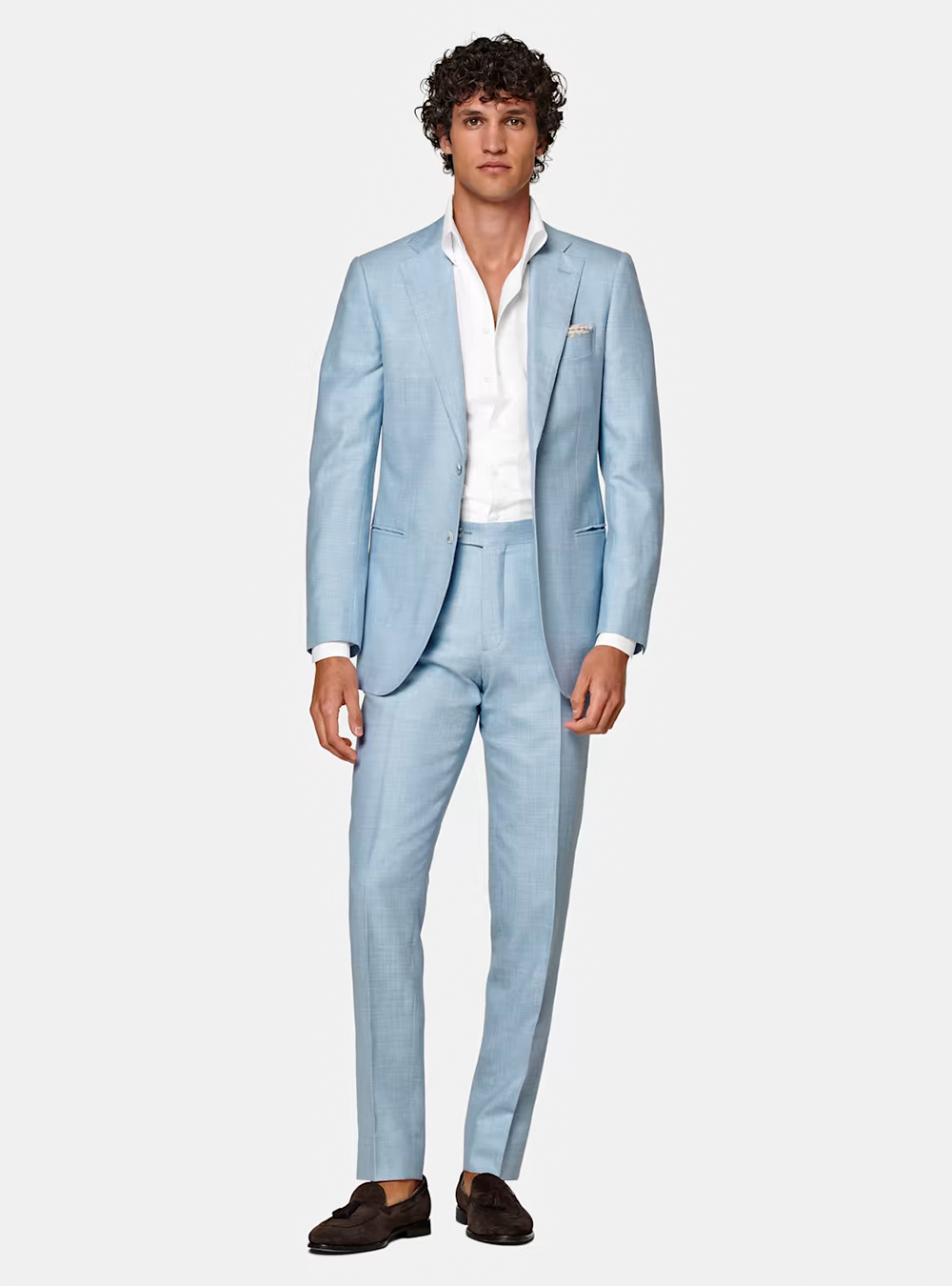 light blue suit, white dress shirt, and brown loafers