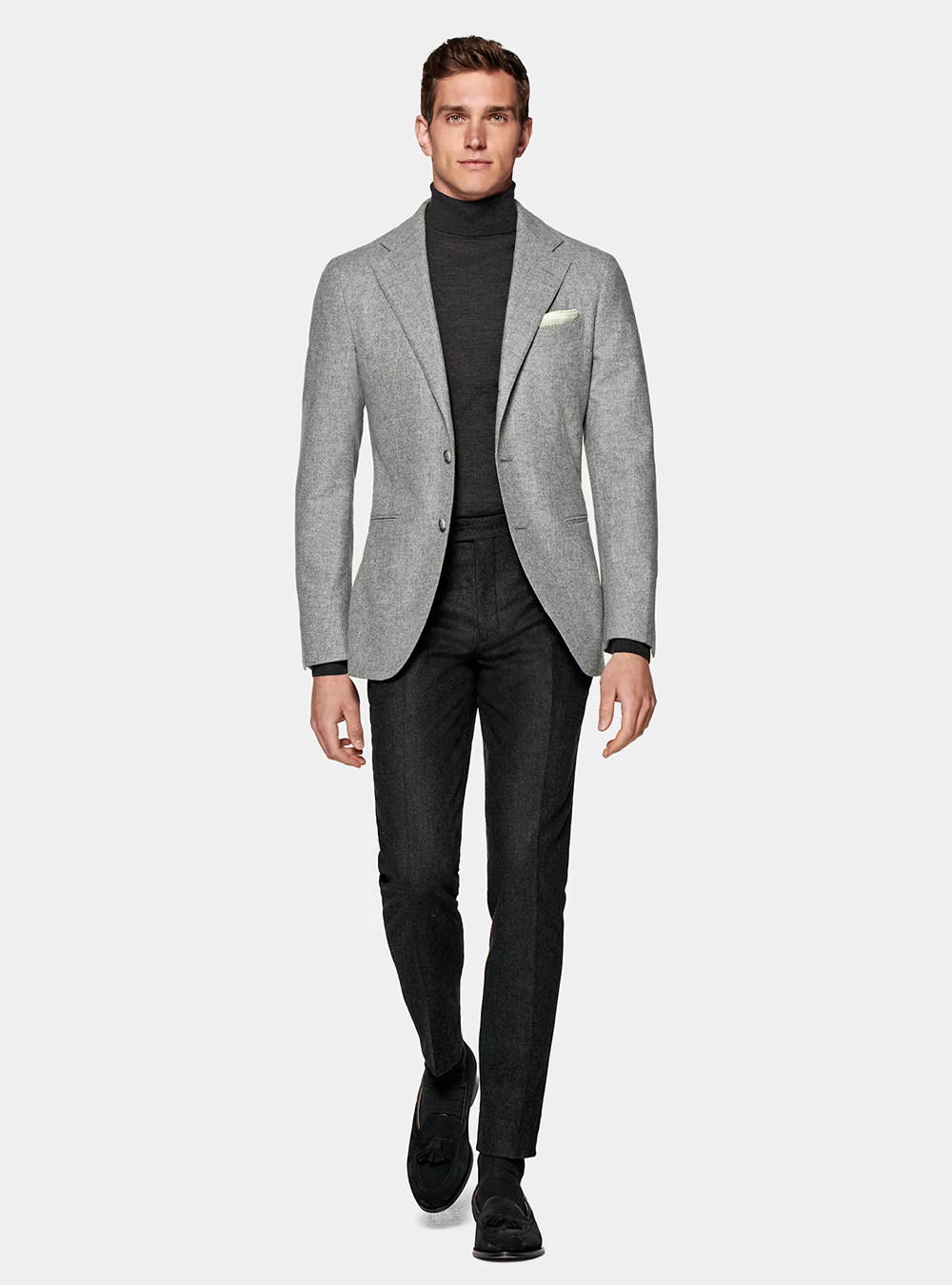 light grey blazer, charcoal turtleneck, and black pants