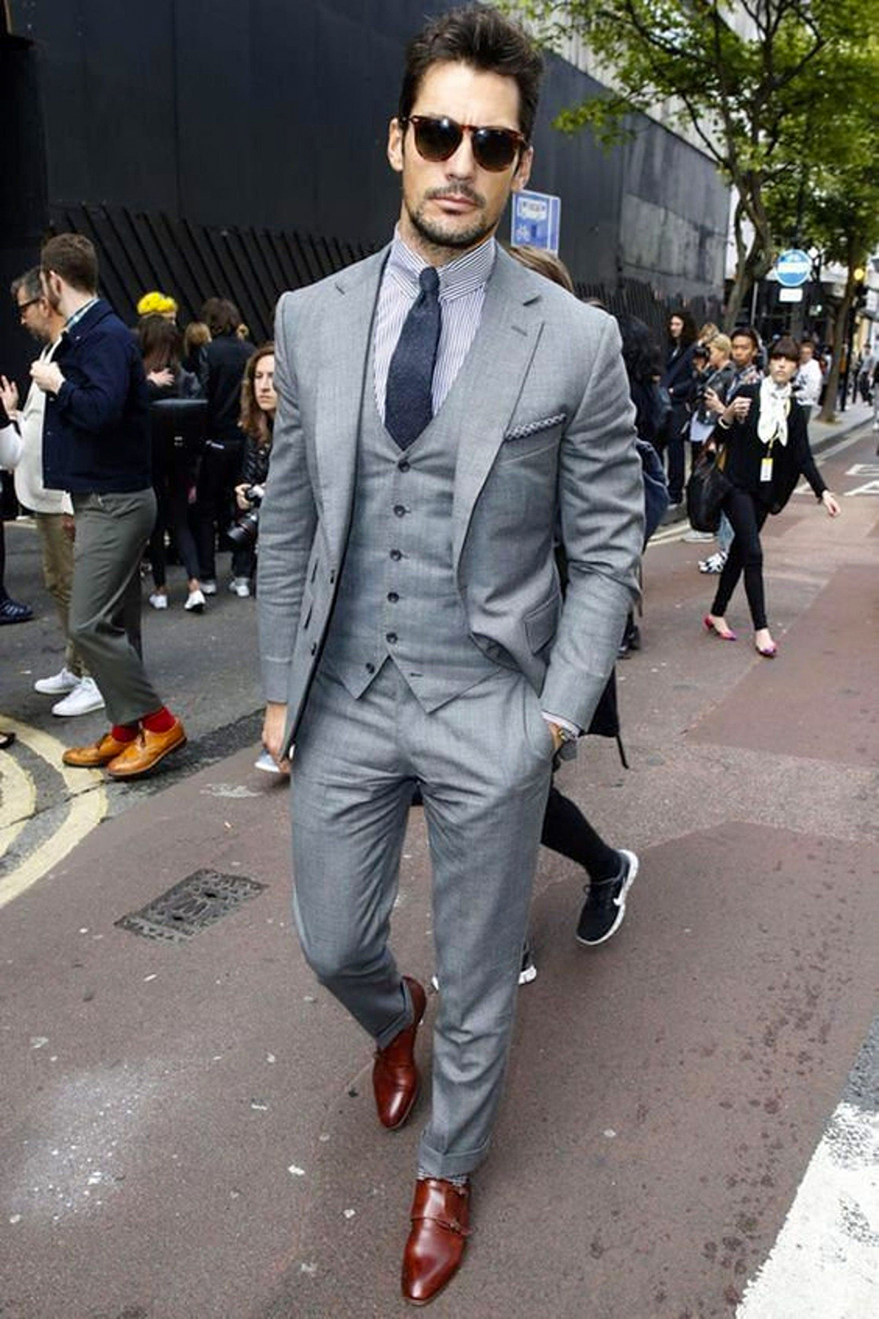 Light grey suit with blue stripe shirt, navy tie and brown shoes color combination