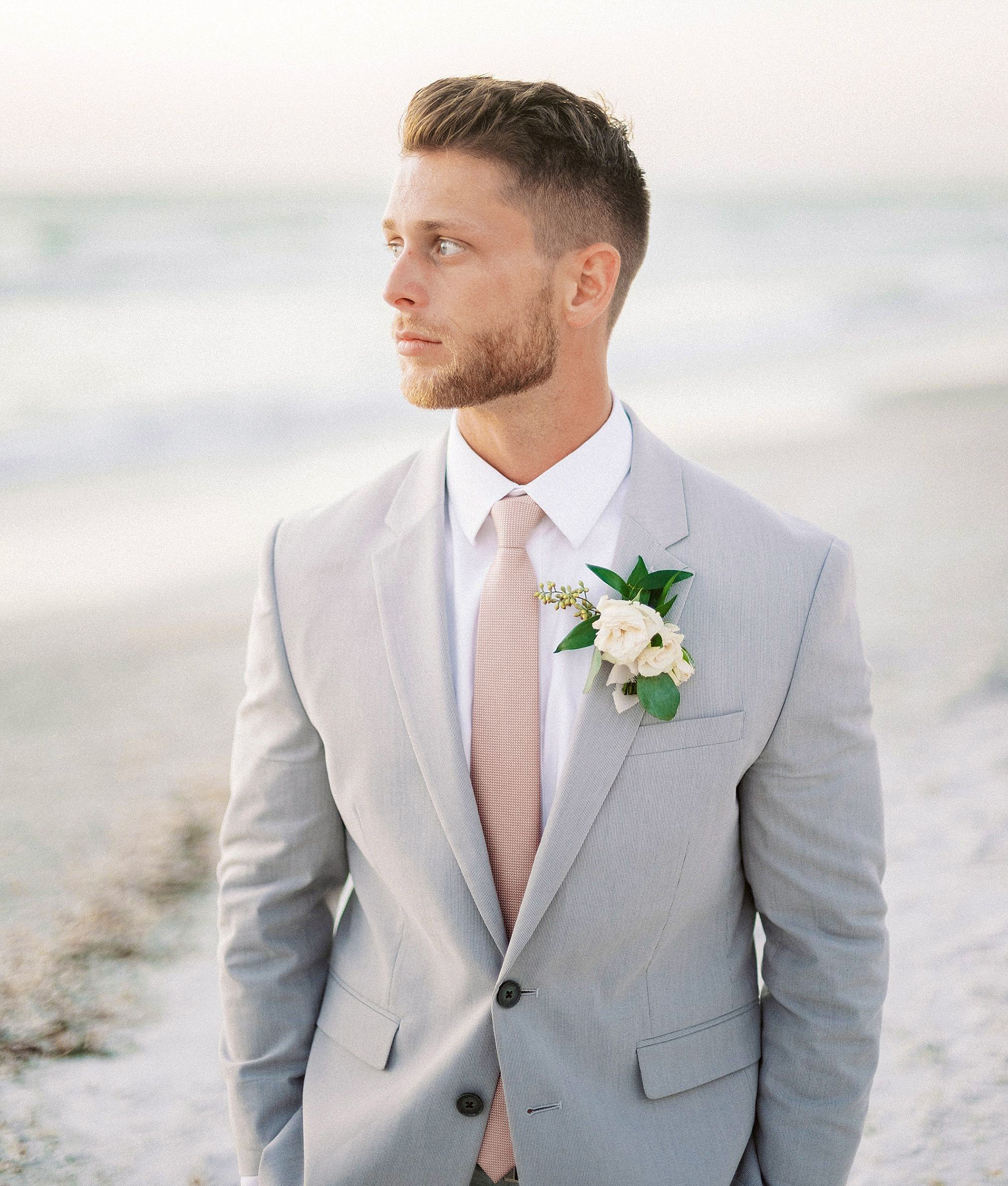 matching light grey suit with whtie shirt and light colored tie