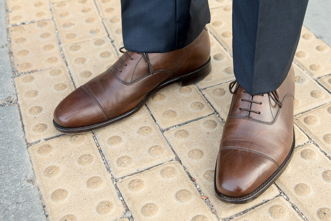 matching dark brown dress shoes with navy blue pants
