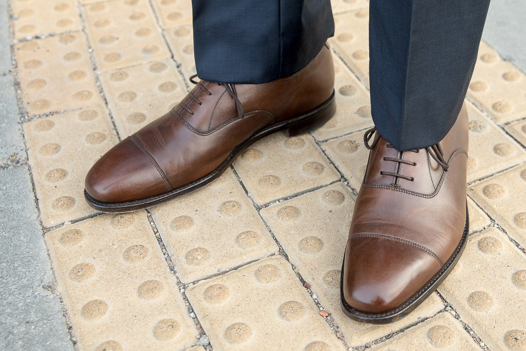 Premium AI Image | A man wearing blue pants with a black shirt and black  shoes.