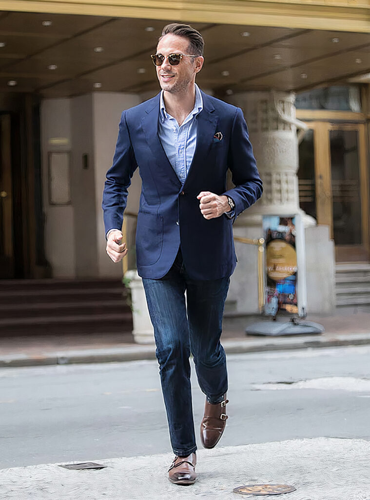 navy blazer, blue dress shirt, dark blue jeans, brown monk straps