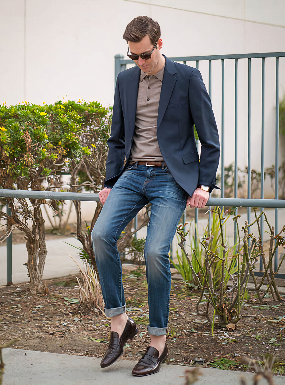 navy blazer, taupe polo shirt, blue jeans, and brown loafers