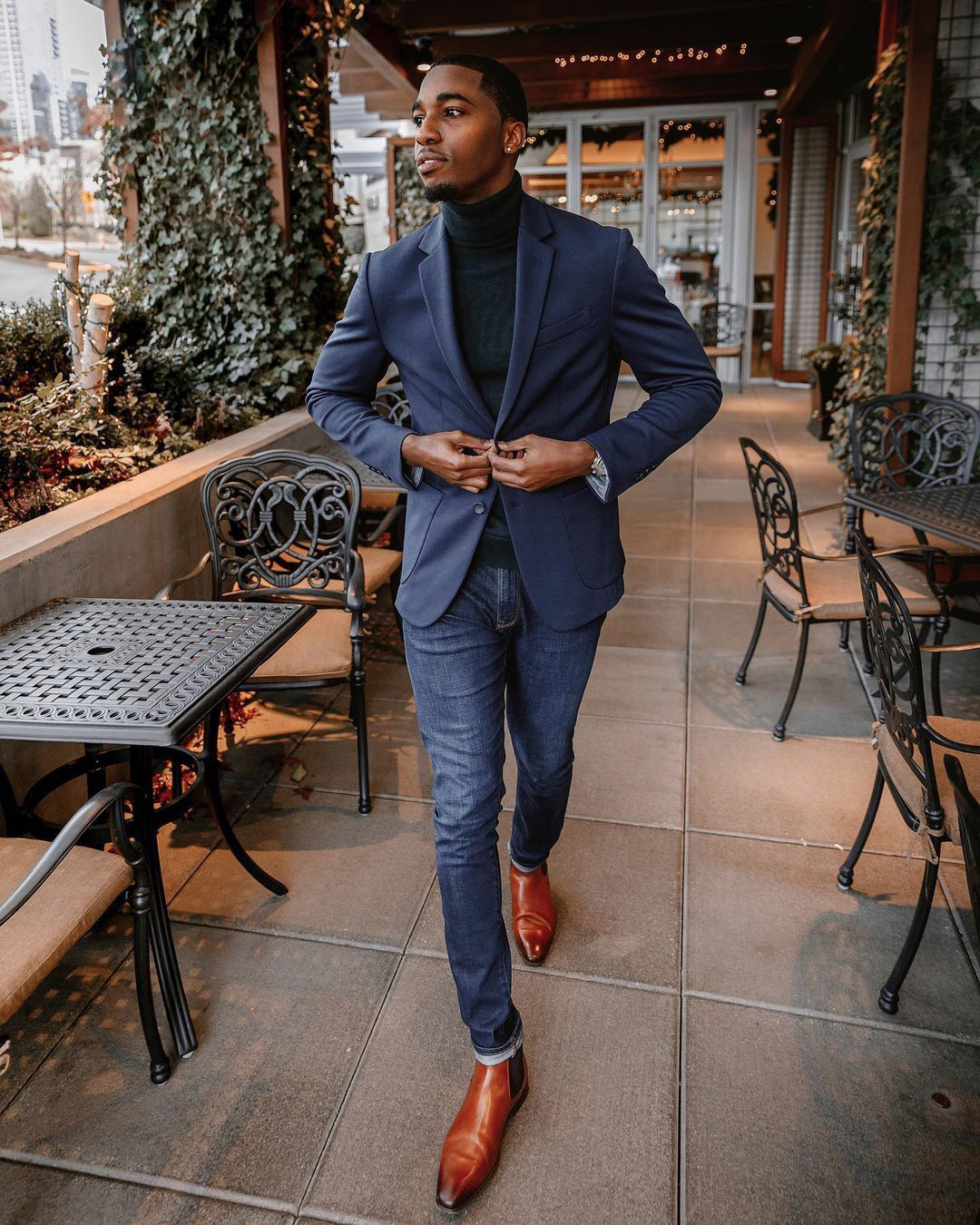 navy blazer, dark green turtleneck, and indigo jeans