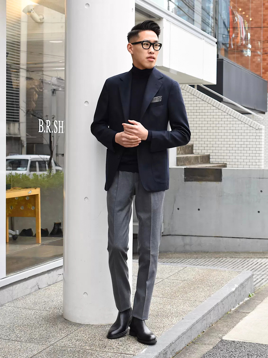 navy blazer, grey dress pants, black turtleneck, and black chelsea boots