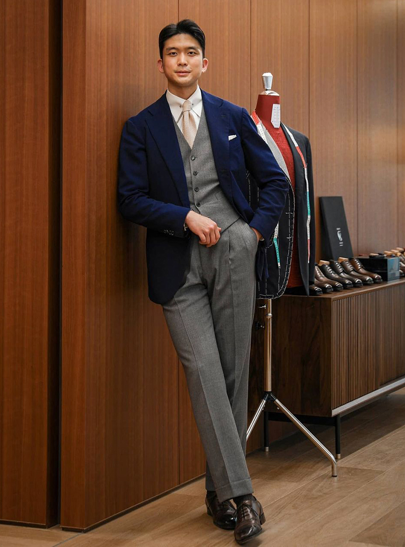 navy blazer, grey vest and pants, and brown Oxford shoes