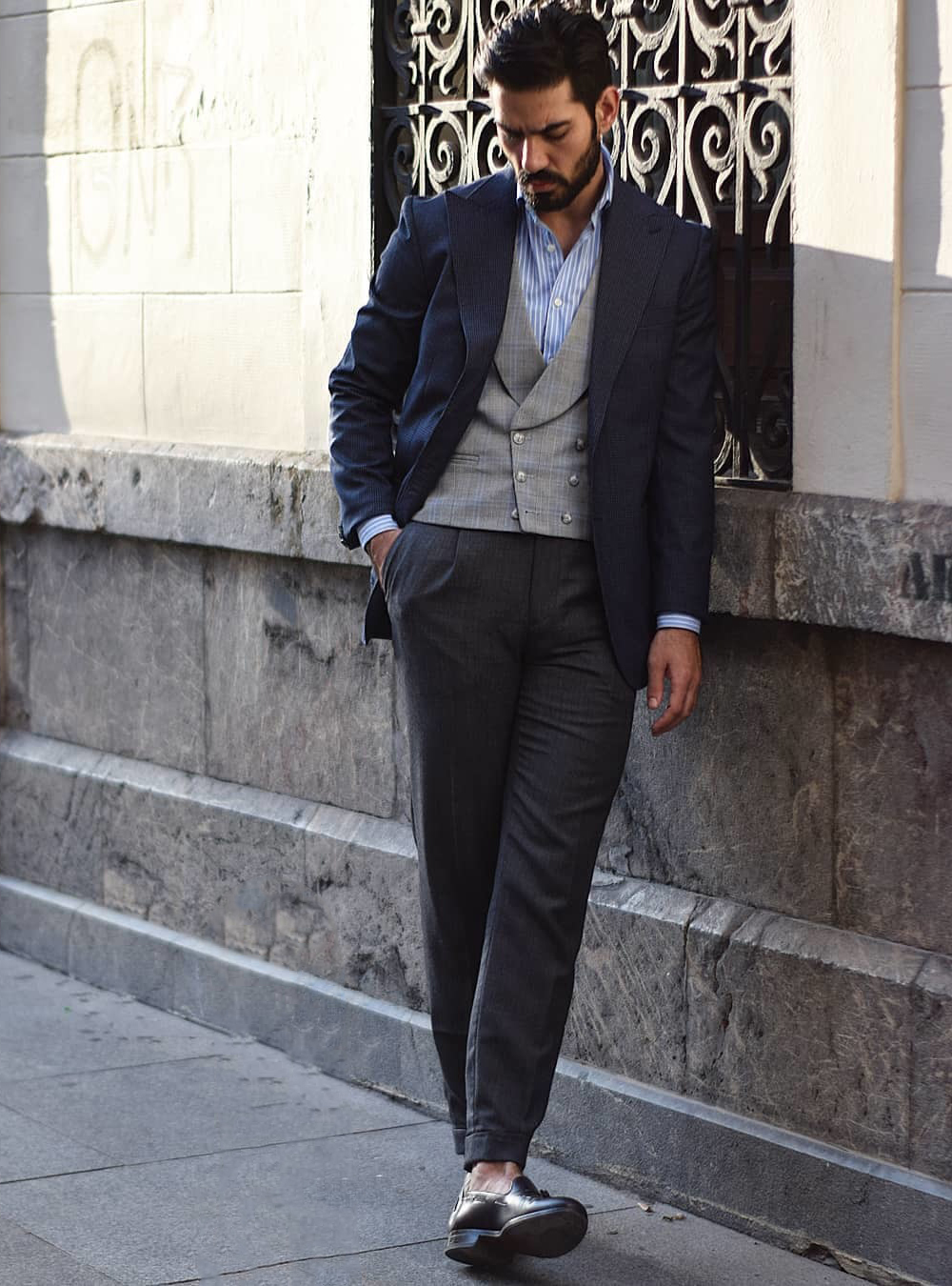 navy blazer, grey waistcoat, and charcoal pants