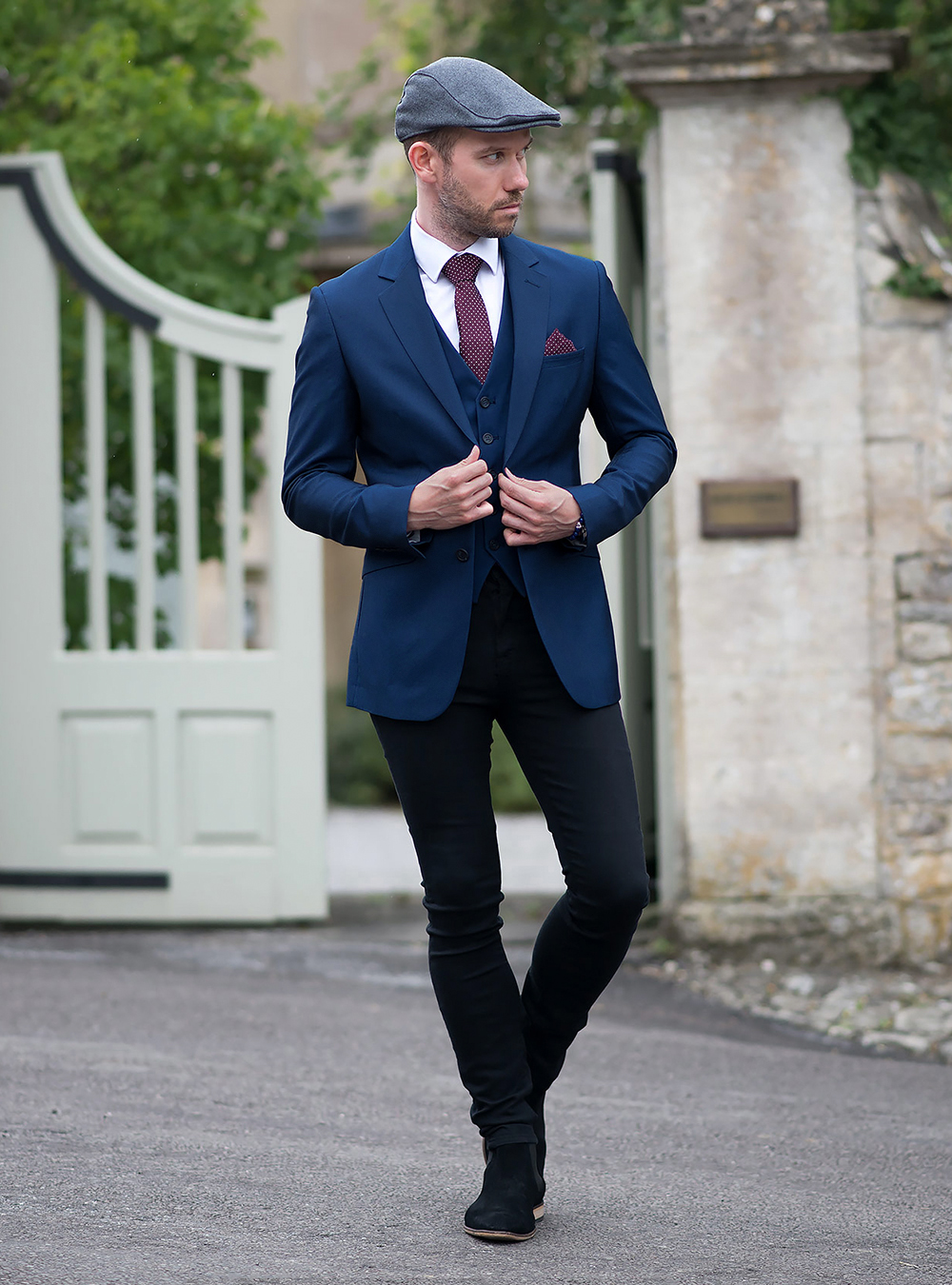 navy blazer, navy blue vest, white shirt, black jeans, and black suede chelsea boots