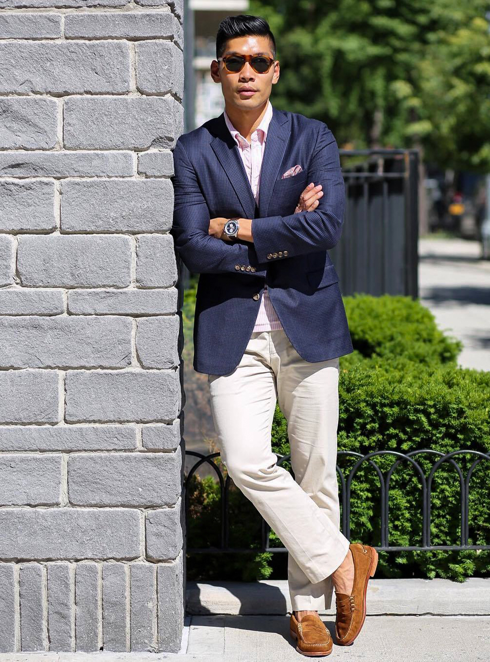 navy blazer, pink polo shirt, beige chinos, and light brown loafers