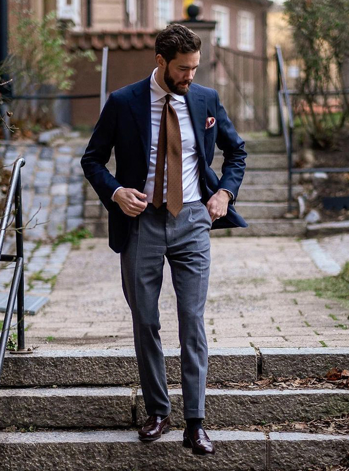 brown tie with a navy blazer and grey pants