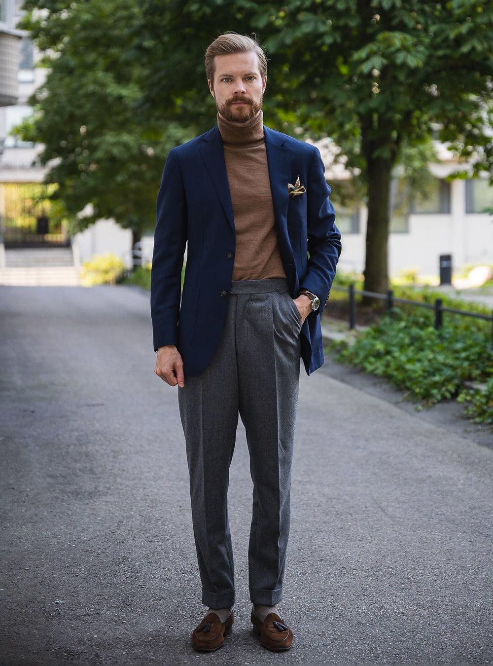Navy blue blazer, brown turtleneck, grey pants, and brown loafers