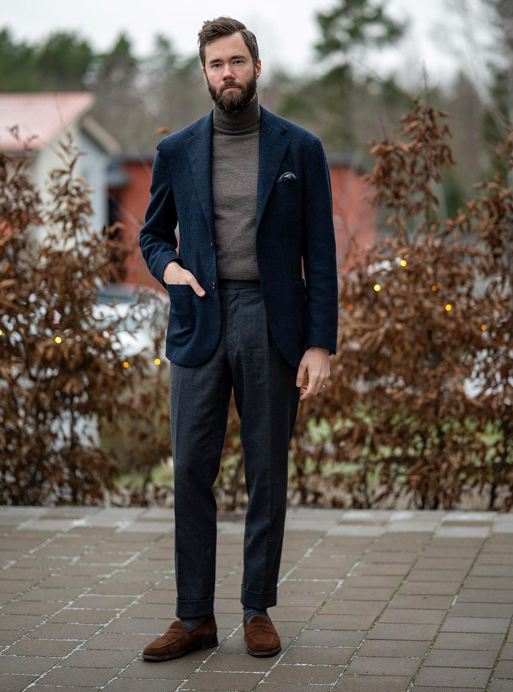 navy blue blazer, grey turtleneck, charcoal pants, and brown loafers