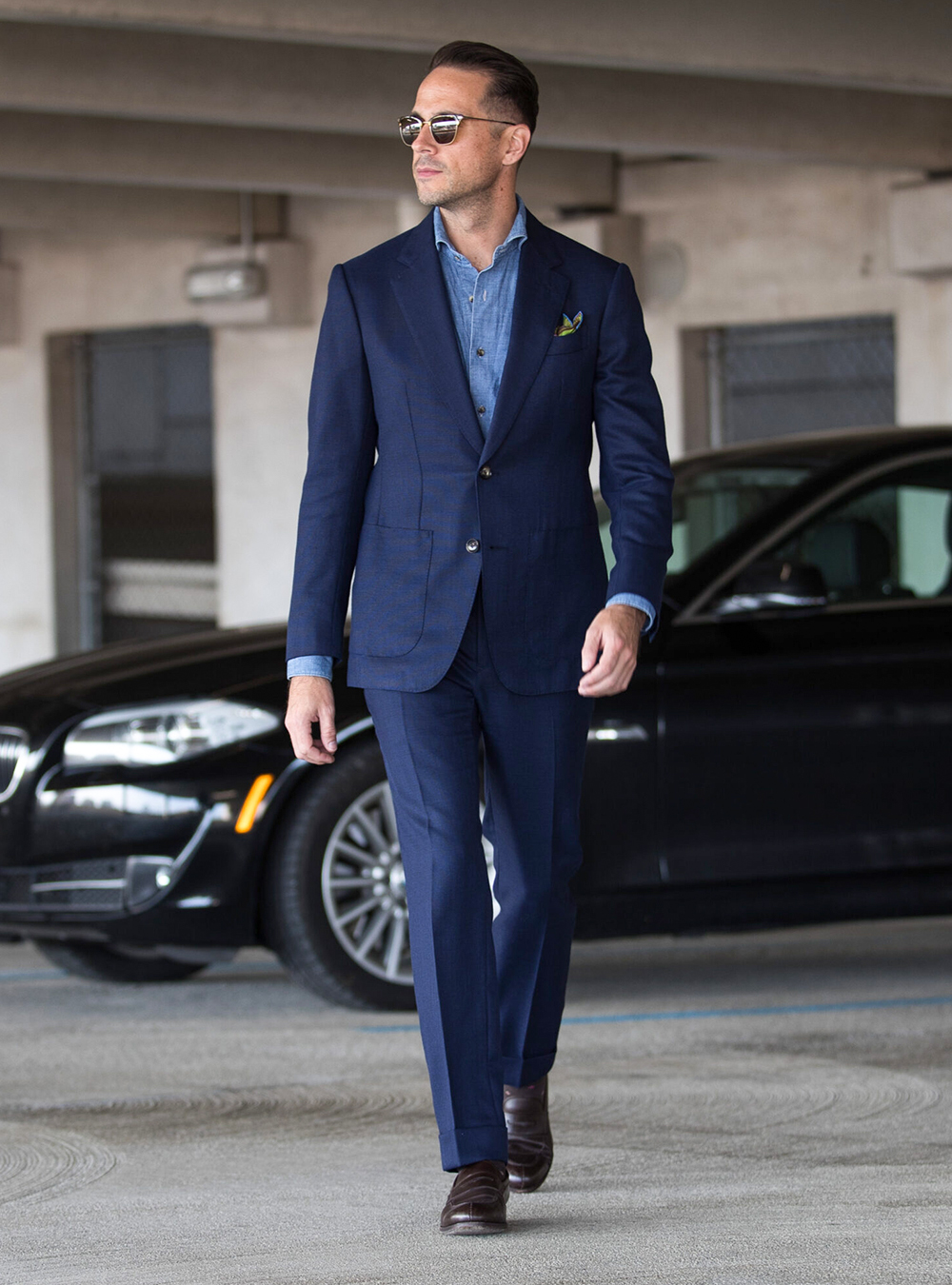 Navy blue hopsack suit, denim shirt and brown loafers