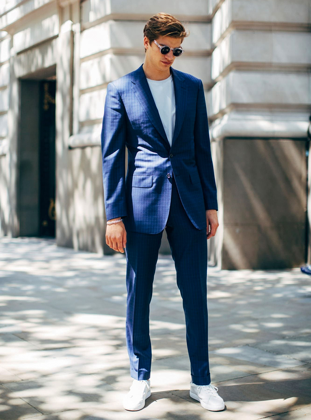 navy blue plaid suit, white t-shirt, and white sneakers