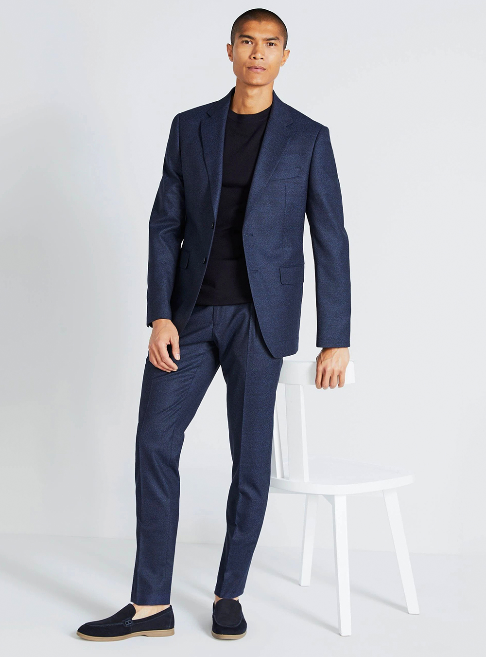 Navy blue suit, black crew neck t-shirt and black suede loafers