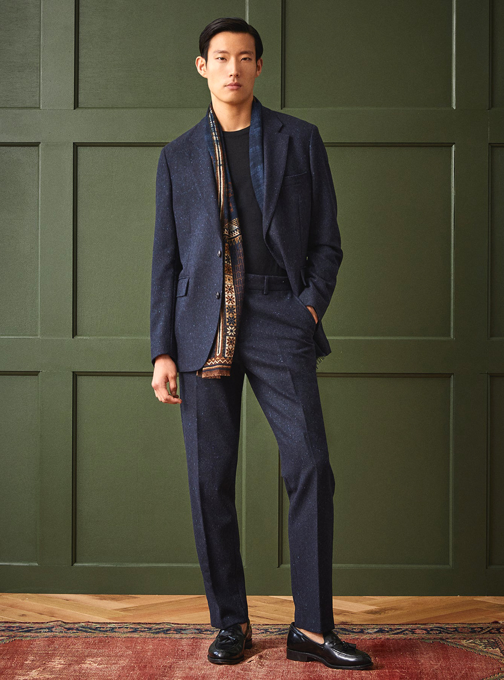 navy blue wool suit, black t-shirt, brown scarf and black loafers