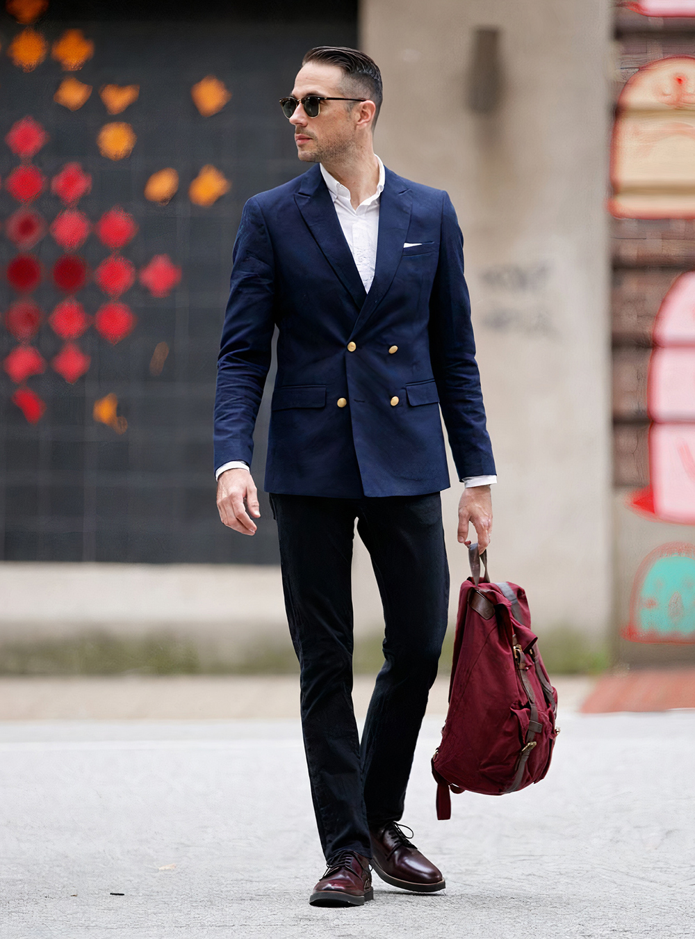 navy double-breasted blazer, white shirt, black jeans, and burgundy derby shoes