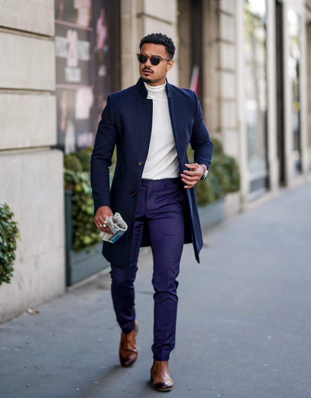 navy overcoat, beige turtleneck, navy dress pants, and brown chelsea boots