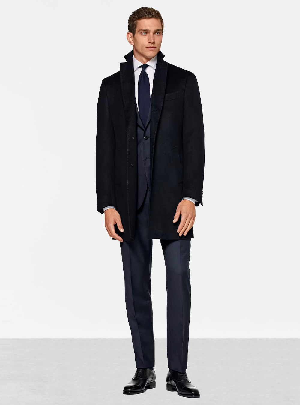 navy overcoat with a navy suit and white shirt