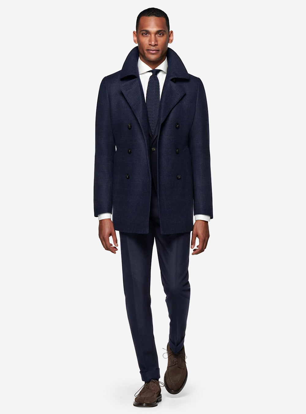navy peacoat, navy suit, white shirt, and navy tie