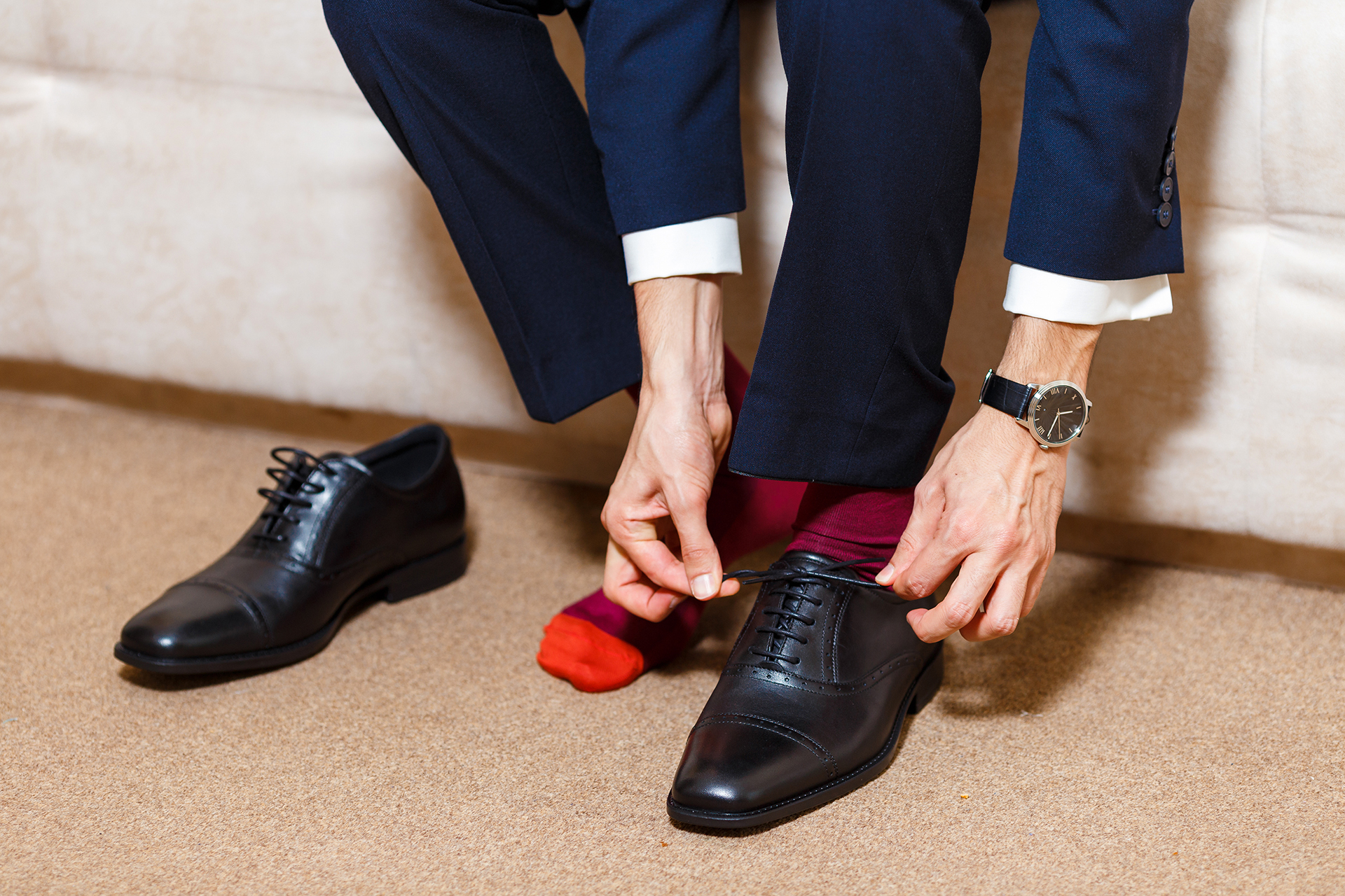 navy suit, burgundy socks, and black oxford shoes