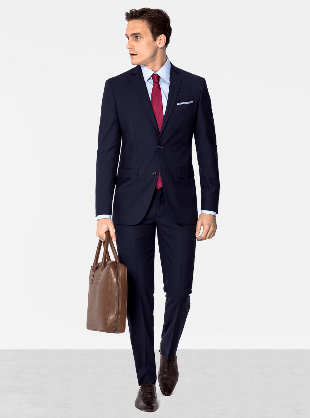 Navy suit, light blue dress shirt, red tie and brown oxford shoes