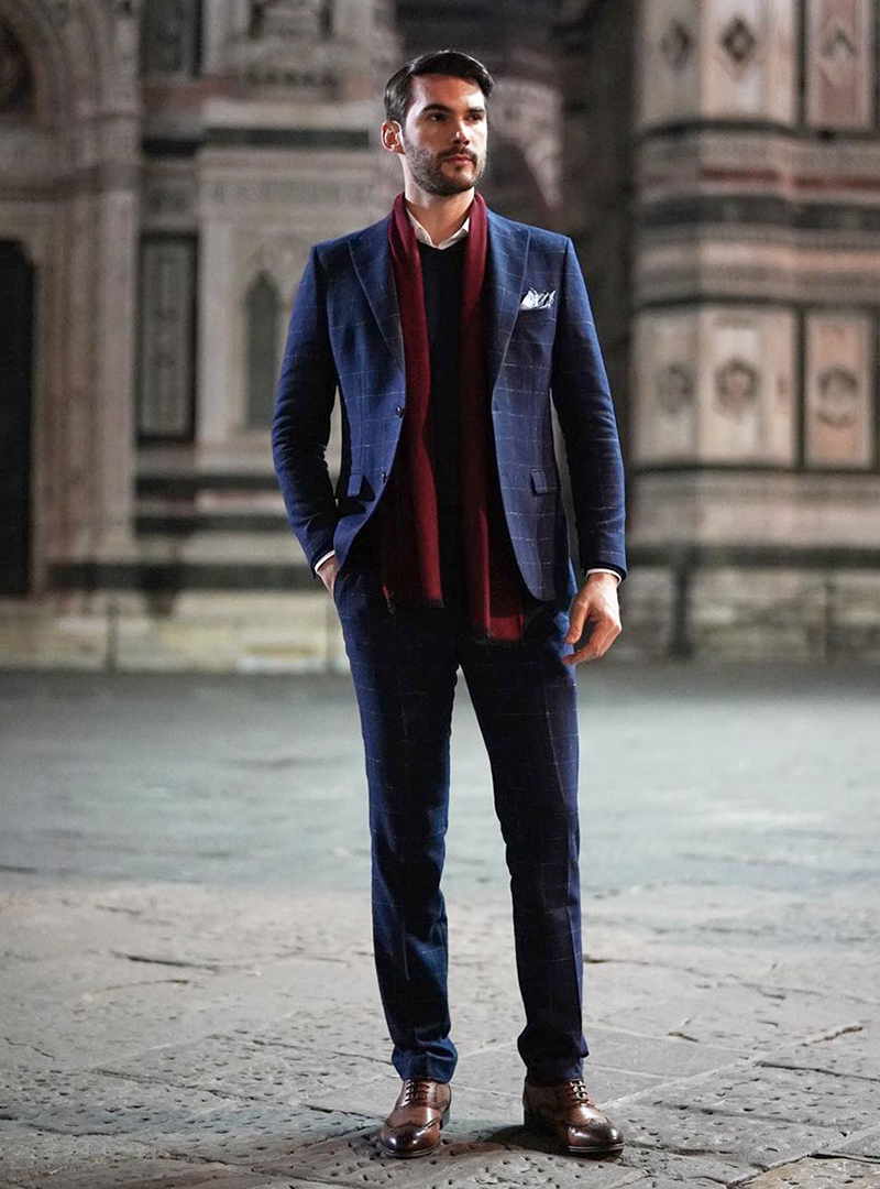 navy suit, burgundy scarf, and brown brogue shoes