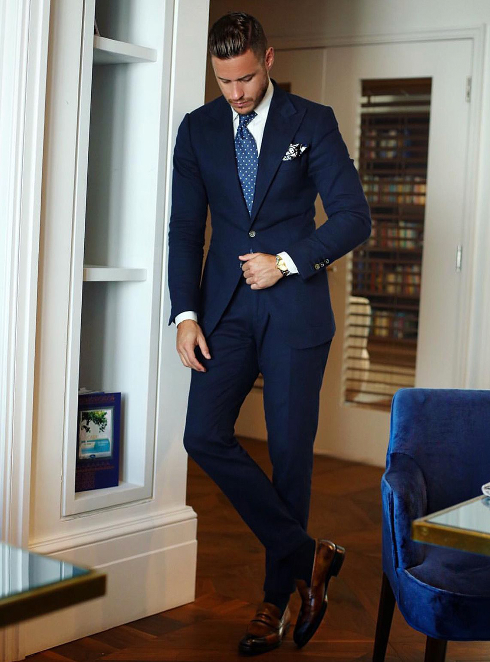 navy suit with a brown loafers and navy dress socks