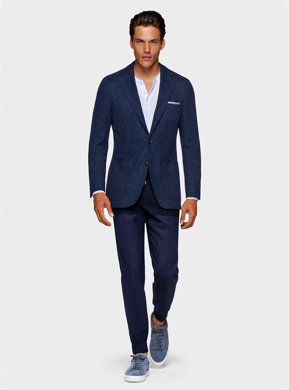 Navy suit, white henley t-shirt and blue sneakers