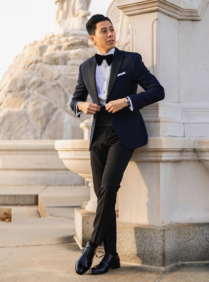 navy tuxedo jacket, white tuxedo shirt, black tuxedo pants, and black oxford shoes