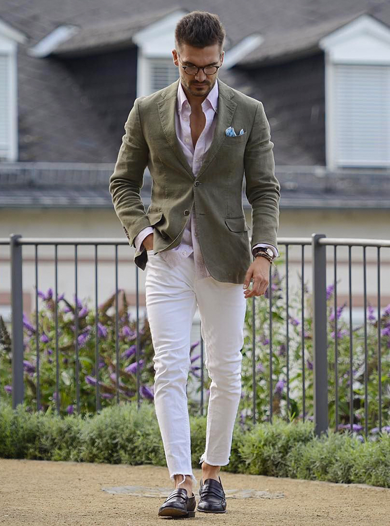 olive green blazer, white shirt, white pants, and black loafers
