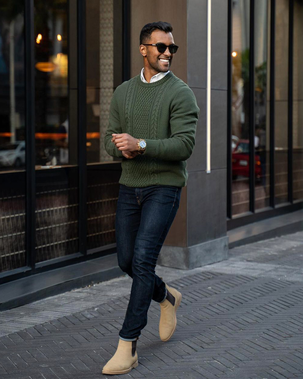 olive green sweater, white shirt, navy jeans, and tan Chelsea boots