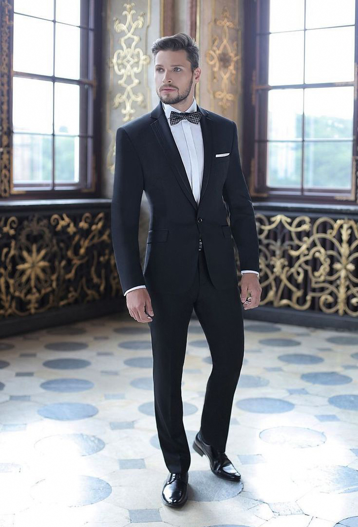 one-button black suit, black derby shoes and white shirt with a bow tie as a wedding outfit