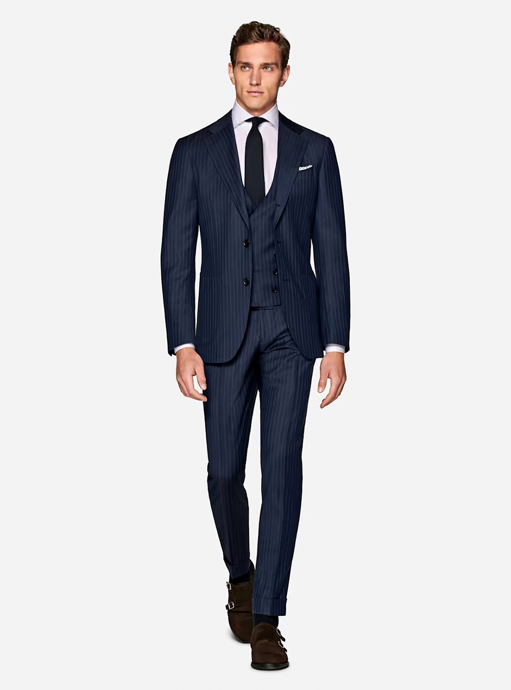 pinstripe blue three-piece suit, white shirt, and brown suede monk straps