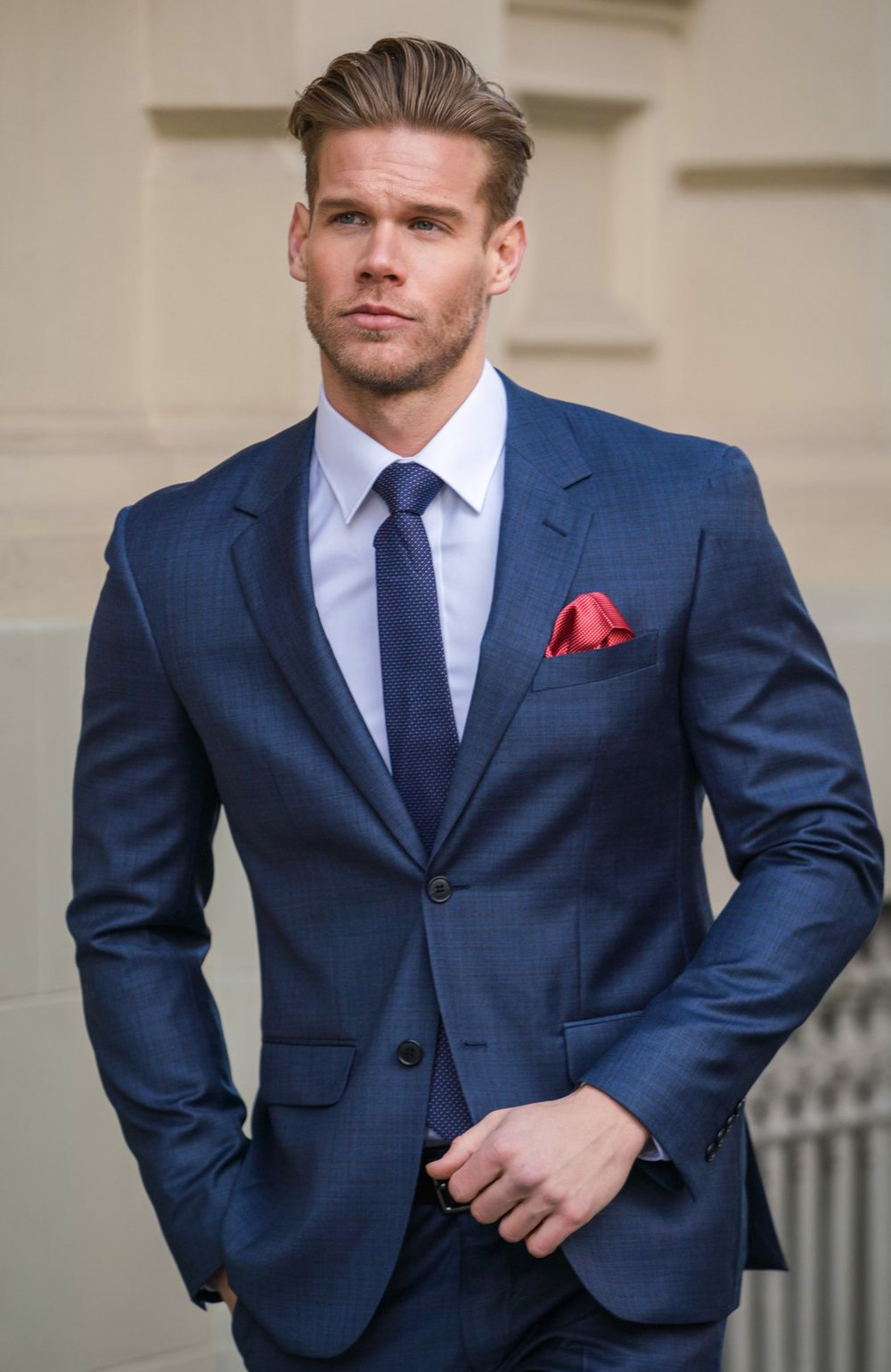 navy suit with white dress shirt and navy tie