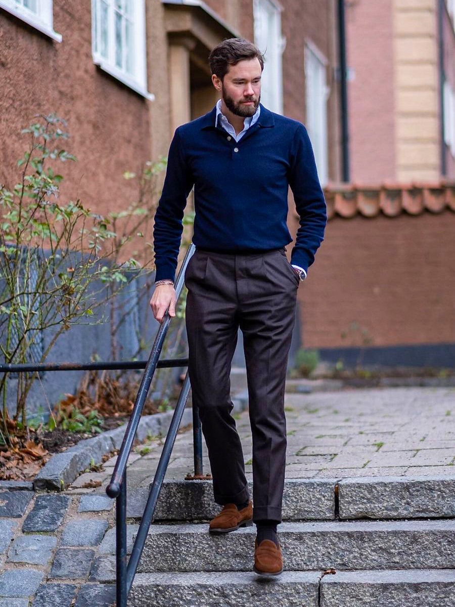 royal blue polo neck sweater over a light blue shirt