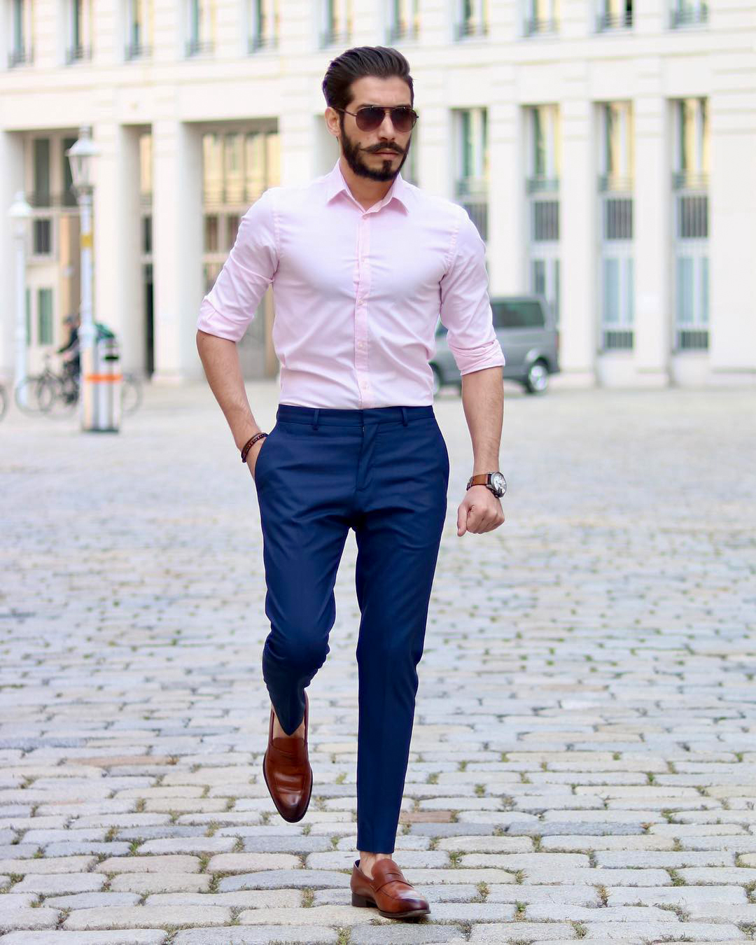 light pink shirt, blue pants, and brown shoes